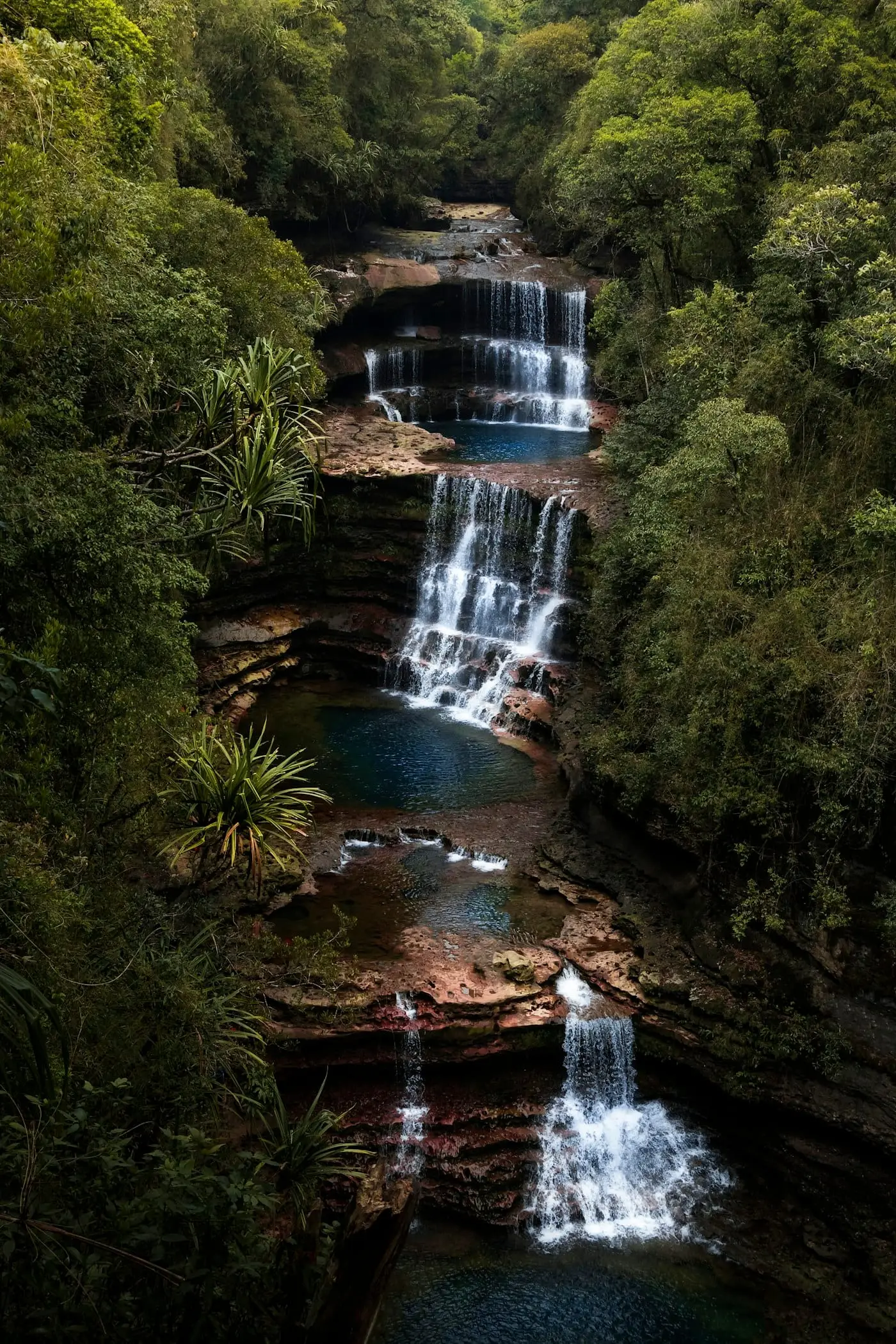 The tiered pools of Wei Sawdong falls hidden in the Cherrapunji forest